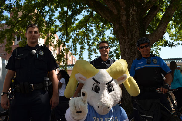 Ramses and UNC Police posing for a photograph at the Fire Safety Fair