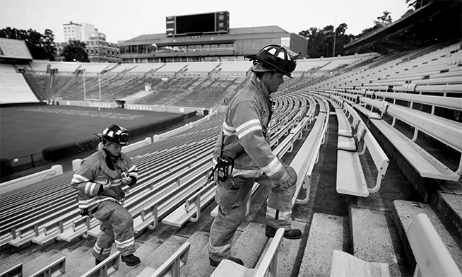 Firefighters climbing Kenan Stadium stairs