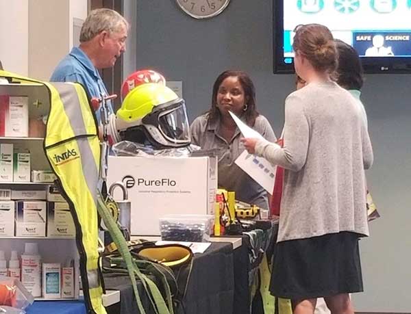 Shop Safety Fair vendors speaking with fair attendees