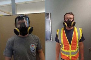 Two staff members with respirators