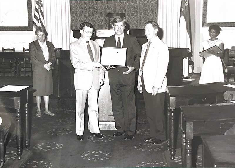 Donald Willhoit receiving award from Gov. Jim Martin